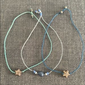 A set of three blue bracelets